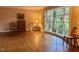 Light-filled living room featuring hardwood floors, a large window, and classic decor at 3604 Woodlawn Rd, Rocky Mount, NC 27804
