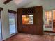 Open living area with custom cabinetry, terracotta tile floors and outdoor view at 3604 Woodlawn Rd, Rocky Mount, NC 27804