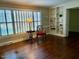 Inviting living room features hardwood floors, built-in bookshelves, and large windows at 3604 Woodlawn Rd, Rocky Mount, NC 27804