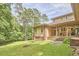 Expansive backyard with tall trees and meticulously manicured lawn is perfect for outdoor enjoyment at 3605 Laurel Creek Way, Durham, NC 27712