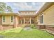 Inviting backyard features a covered porch and well-maintained landscaping at 3605 Laurel Creek Way, Durham, NC 27712
