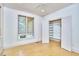 Bright bedroom features a closet with custom shelving and a window with natural light at 3605 Laurel Creek Way, Durham, NC 27712