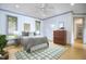 Bedroom featuring hardwood floors, ceiling fan, and natural light at 3605 Laurel Creek Way, Durham, NC 27712