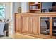 Detailed shot of custom built-in cabinetry featuring glass doors and accent lighting at 3605 Laurel Creek Way, Durham, NC 27712