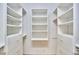 A walk-in closet with built-in shelving and drawers with chrome drawer pulls at 3605 Laurel Creek Way, Durham, NC 27712