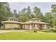 Stunning single-story home with manicured lawn and lovely trees in a private setting at 3605 Laurel Creek Way, Durham, NC 27712