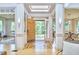 Bright foyer with high ceilings, skylights, and an elegant wood floor design, offering views of the exterior at 3605 Laurel Creek Way, Durham, NC 27712