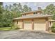 Spacious two-car garage with driveway and brick siding at 3605 Laurel Creek Way, Durham, NC 27712