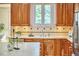 Kitchen featuring a stainless steel dishwasher, wood cabinets and white countertops at 3605 Laurel Creek Way, Durham, NC 27712