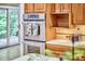 Kitchen with double oven, wood cabinets, and access to an outdoor space at 3605 Laurel Creek Way, Durham, NC 27712