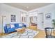 Charming living room offering a comfortable blue sofa, stylish decor, and open access to the rest of the home at 3605 Laurel Creek Way, Durham, NC 27712