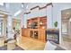 Bright living room with fireplace, hardwood floors, custom built-ins, and ample natural light at 3605 Laurel Creek Way, Durham, NC 27712