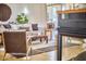 Living room with a neutral color palette, hardwood floors, and seamless access to other rooms at 3605 Laurel Creek Way, Durham, NC 27712