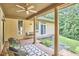 Comfortable seating on the covered porch provides an inviting place to relax outdoors at 3605 Laurel Creek Way, Durham, NC 27712