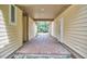 Covered walkway between buildings is made of brick with an open-air view at 3605 Laurel Creek Way, Durham, NC 27712