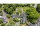 Aerial view showcasing a large home and manicured garden with water feature and sitting area at 384 Lyndfield Cl W, Pittsboro, NC 27312