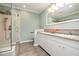 Renovated bathroom with glass shower, tile flooring and double sink vanity at 384 Lyndfield Cl W, Pittsboro, NC 27312