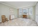 Light-filled bedroom with large windows and neutral carpeting at 384 Lyndfield Cl W, Pittsboro, NC 27312