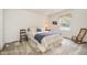 Cozy bedroom with neutral walls and carpet, large window, and two chairs at 384 Lyndfield Cl W, Pittsboro, NC 27312