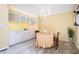 Charming dining area with built-in cabinets, a chandelier, and a table set for a meal, offering a cozy atmosphere at 384 Lyndfield Cl W, Pittsboro, NC 27312