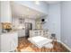 Spacious eat-in kitchen with stainless steel appliances, white cabinetry and an island at 384 Lyndfield Cl W, Pittsboro, NC 27312
