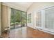 Relaxing screened porch with brick flooring, offering a tranquil space to enjoy the outdoors at 384 Lyndfield Cl W, Pittsboro, NC 27312