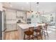 Bright kitchen boasts a large island with seating and updated cabinets at 40 Ironwood Blvd, Youngsville, NC 27596