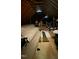 Unfinished attic space with insulation and wooden beams, offering potential for storage or expansion at 4001 Falls River Ave, Raleigh, NC 27614