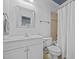 Bright bathroom featuring a vanity, toilet, and shower with curtain at 4001 Falls River Ave, Raleigh, NC 27614