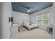 A comfy bedroom with white walls, desk, and soft carpet flooring at 4001 Falls River Ave, Raleigh, NC 27614