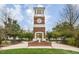 Beautiful brick clock tower with classic architectural details and landscaped surroundings at 4001 Falls River Ave, Raleigh, NC 27614