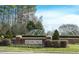 Bedford community sign nestled in landscaped greenery, welcoming residents and visitors at 4001 Falls River Ave, Raleigh, NC 27614