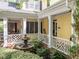 Enchanting courtyard with a fountain, lush greenery, and covered porch offering a peaceful outdoor retreat at 4001 Falls River Ave, Raleigh, NC 27614