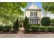 Attractive two-story home with manicured landscaping and a brick walkway leading to the inviting entrance at 4001 Falls River Ave, Raleigh, NC 27614