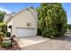 Spacious two-car garage with a basketball hoop, side yard, and paved driveway at 4001 Falls River Ave, Raleigh, NC 27614