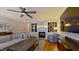 Inviting living room with fireplace, built-in shelving, and hardwood floors at 4001 Falls River Ave, Raleigh, NC 27614