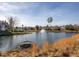 Community pond with fountain amidst well-maintained lawns and residential homes at 4001 Falls River Ave, Raleigh, NC 27614