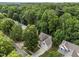 Aerial view of the home nestled among beautiful, mature trees in neighborhood at 412 Hay River St, Garner, NC 27529