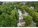 Aerial view of the tree-lined neighborhood and lush surroundings at 412 Hay River St, Garner, NC 27529