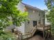 Exterior view of the home's siding, backyard, deck, and sliding glass door at 412 Hay River St, Garner, NC 27529