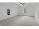 Bonus room featuring a ceiling fan and built-in shelving at 412 Hay River St, Garner, NC 27529
