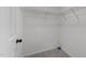 Walk-in closet with shelving unit at 412 Hay River St, Garner, NC 27529