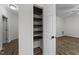 Walk-in closet with wooden shelves at 412 Hay River St, Garner, NC 27529
