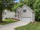 Two-story home with a two car garage and a well-maintained lawn and driveway at 412 Hay River St, Garner, NC 27529