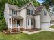 Charming two-story home with well-manicured lawn and welcoming front porch at 412 Hay River St, Garner, NC 27529