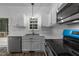 Bright kitchen showcasing stainless steel appliances, white cabinets, and modern fixtures at 412 Hay River St, Garner, NC 27529