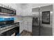 Modern kitchen featuring stainless steel appliances and white cabinets at 412 Hay River St, Garner, NC 27529