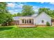 Backyard view featuring the patio and manicured lawn at 417 N Gurney St, Burlington, NC 27215