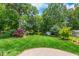 Manicured lawn and landscaping in the backyard at 417 N Gurney St, Burlington, NC 27215