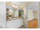 Bathroom with a granite vanity and a view into the shower with glass enclosure at 417 N Gurney St, Burlington, NC 27215
